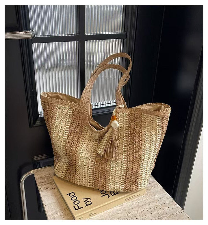 Handcrafted straw bag with elegant tassels and detailed texture Kalsten