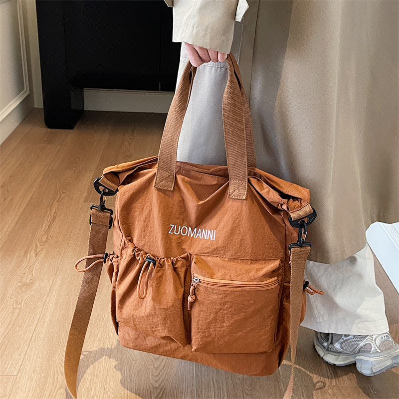 Tote bag with multifunctional outer pockets and adjustable shoulder strap Kalsten