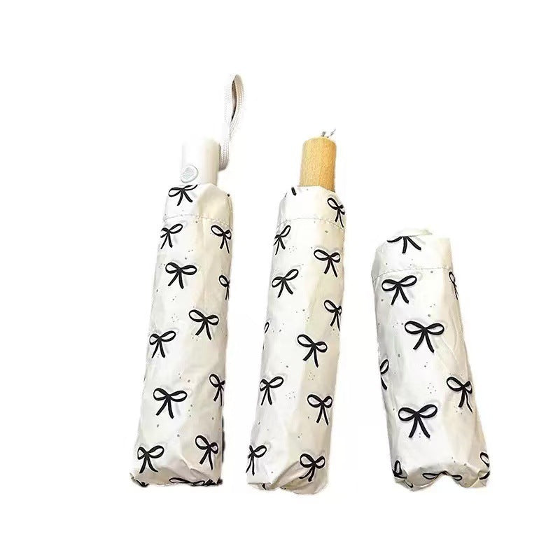 Women's foldable umbrella with elegant bow design Kalsten