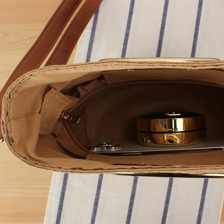 Shoulder bag made of hand-woven natural material with elegant ring closure Kalsten