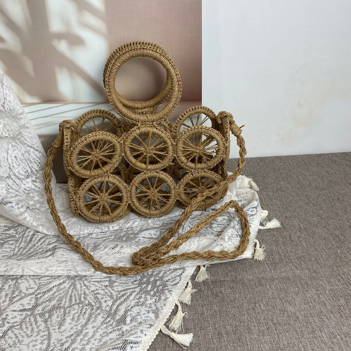 Artisan woven basket bag with striking wheel pattern Kalsten