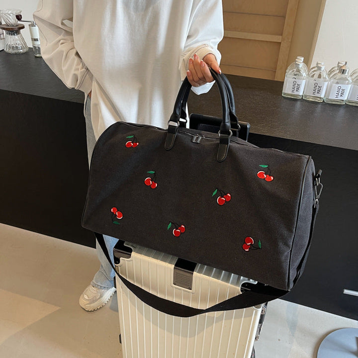 Sporty weekend bag with playful cherry pattern Kalsten