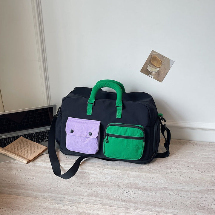Sporty travel bag with multifunctional outer pockets Kalsten
