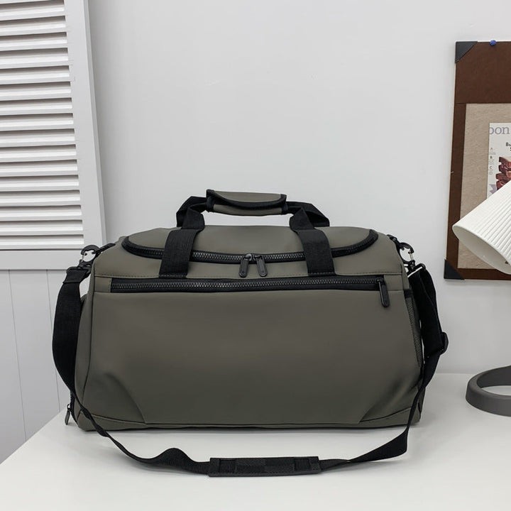 Sporty travel bag with reinforced carrying handles and multiple compartments Kalsten
