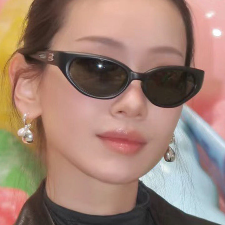 Ladies extravagant sunglasses with curved design Kalsten