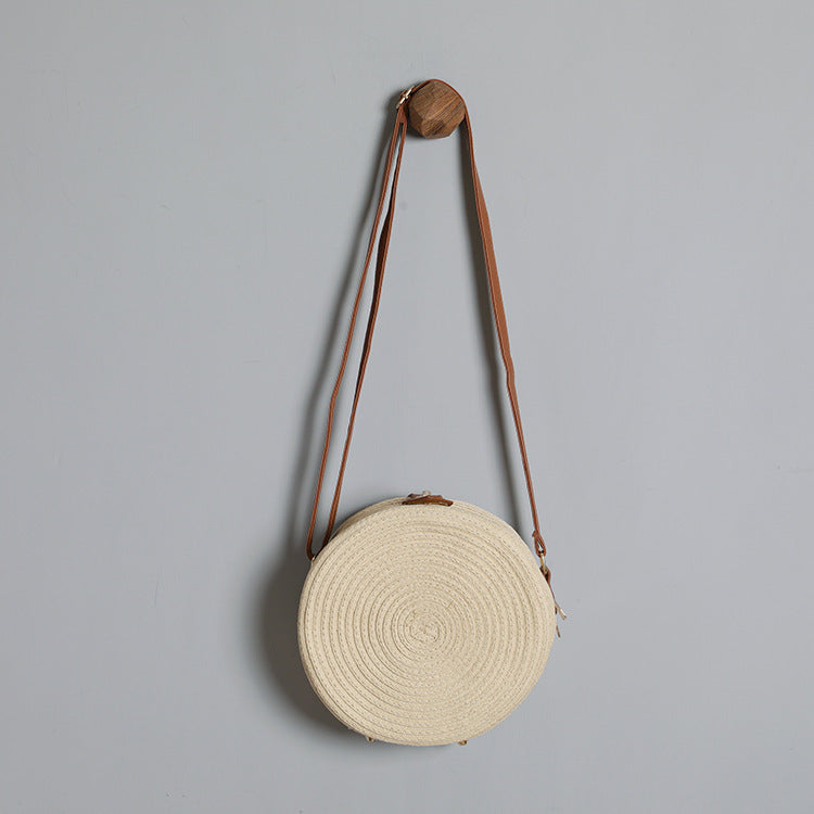 Round shoulder bag made of natural material with stylish accents Kalsten
