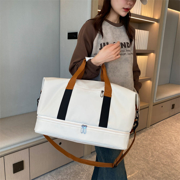 Sporty travel bag with sturdy carrying handles and adjustable shoulder strap Kalsten