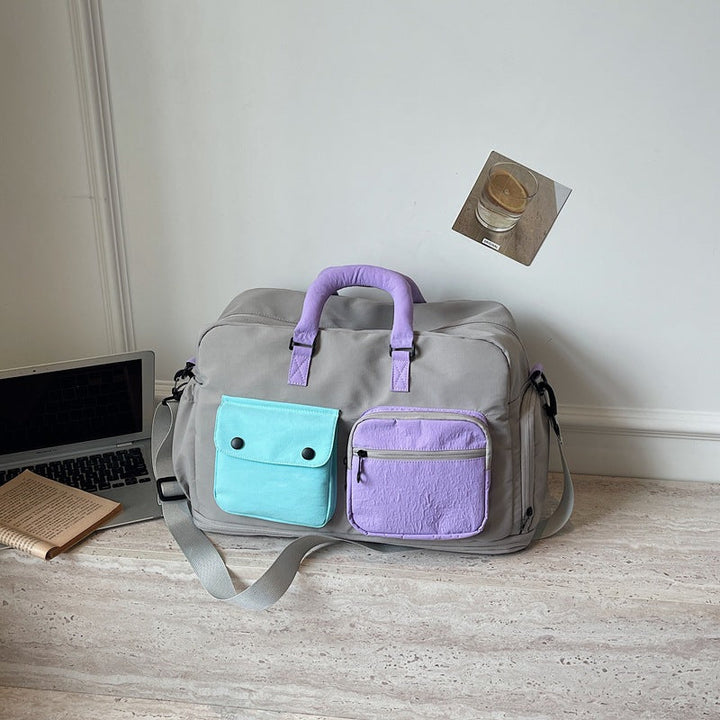 Sporty travel bag with multifunctional outer pockets Kalsten