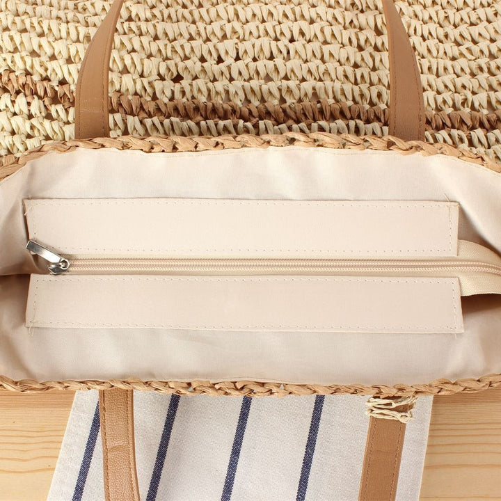 Handbag made of braided natural material with decorative tassel pendant Kalsten