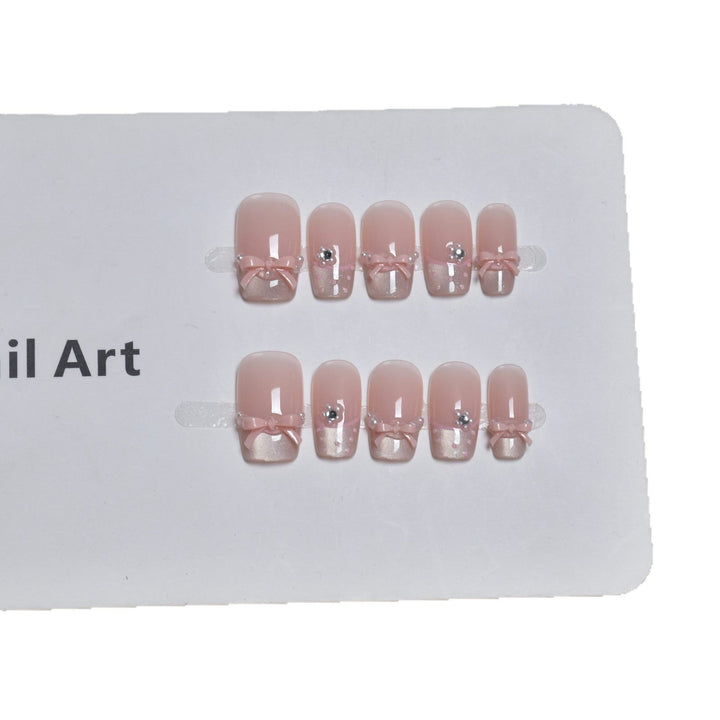 Elegant French Tip Press-On Nail Art with Bow Accents Kalsten