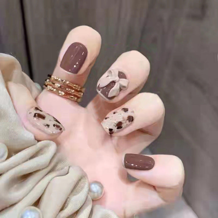 Artificial nails with heart accent and glamorous decorations Kalsten