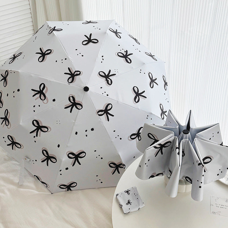 Women’s Folding Umbrella with Playful Bow Pattern Kalsten