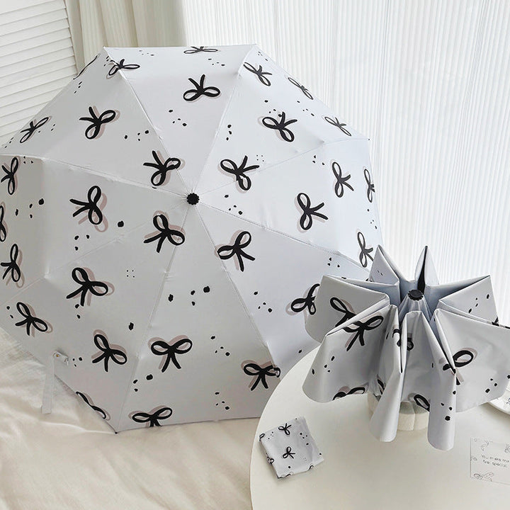 Women’s Folding Umbrella with Playful Bow Pattern Kalsten
