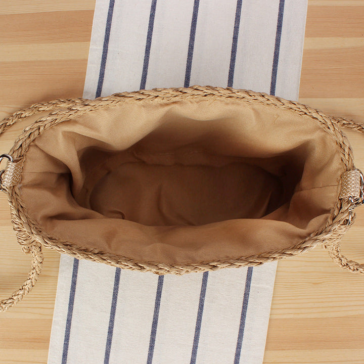 Handbag made of hand-woven natural material with pearl decoration Kalsten