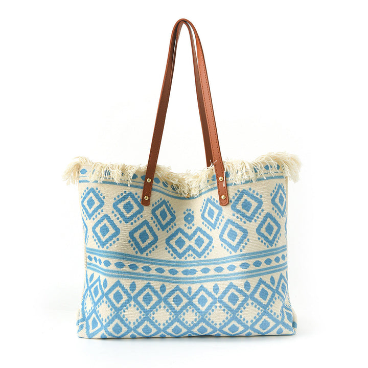 Beach bag with floral pattern and fringes Kalsten