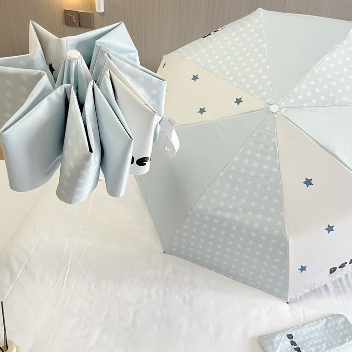 Women's folding umbrella with unique star pattern and practical carrying bag Kalsten