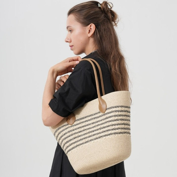 Beach bag made of natural woven material with elegant accents Kalsten