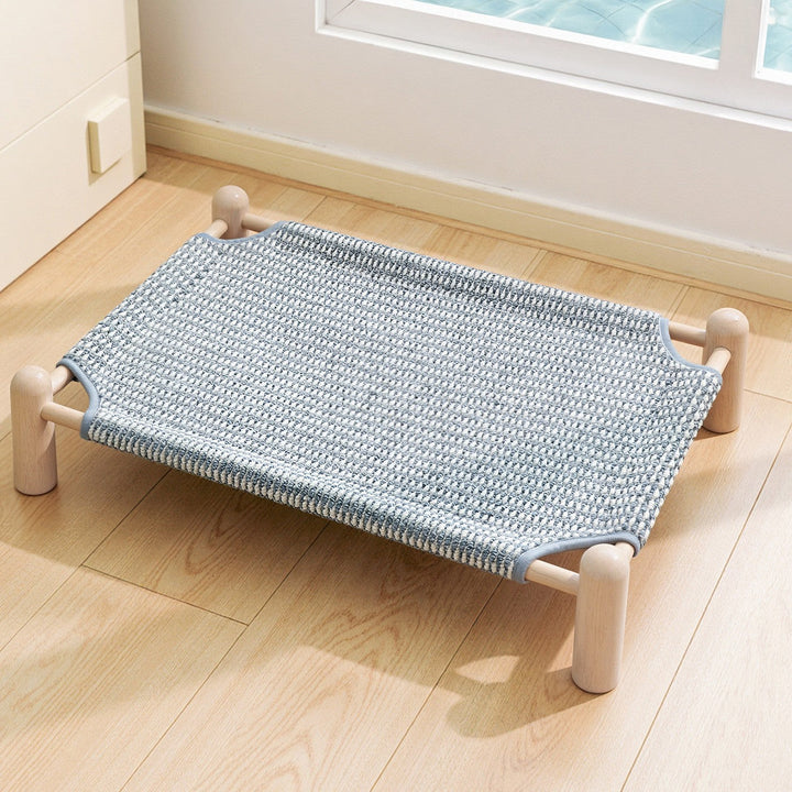 Unisex nan raised wooden pet bed with breathable, woven cover Kalsten