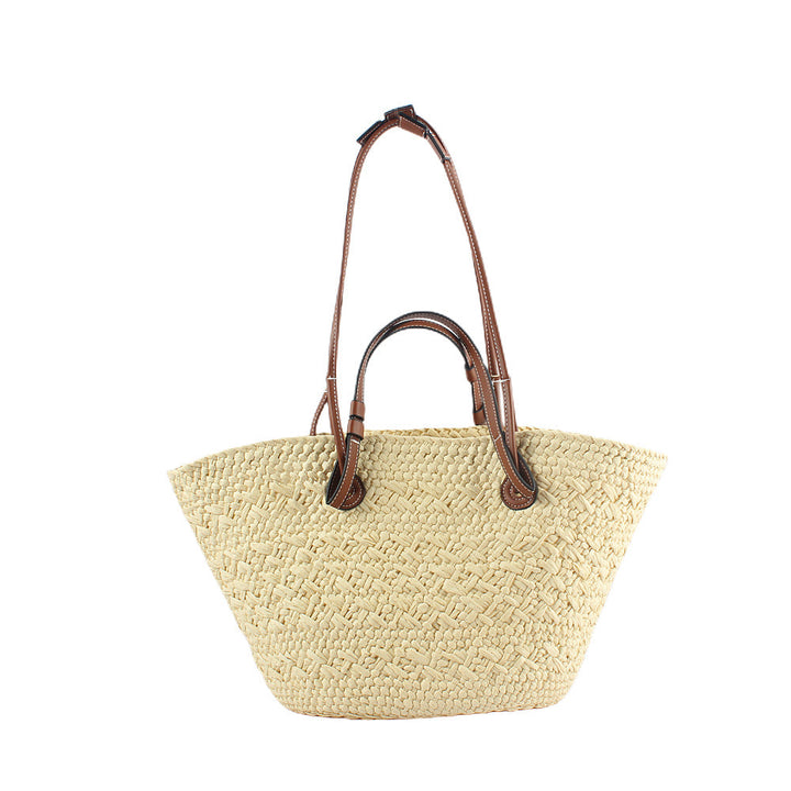 Elegant handbag made of woven natural material with sturdy leather handles Kalsten