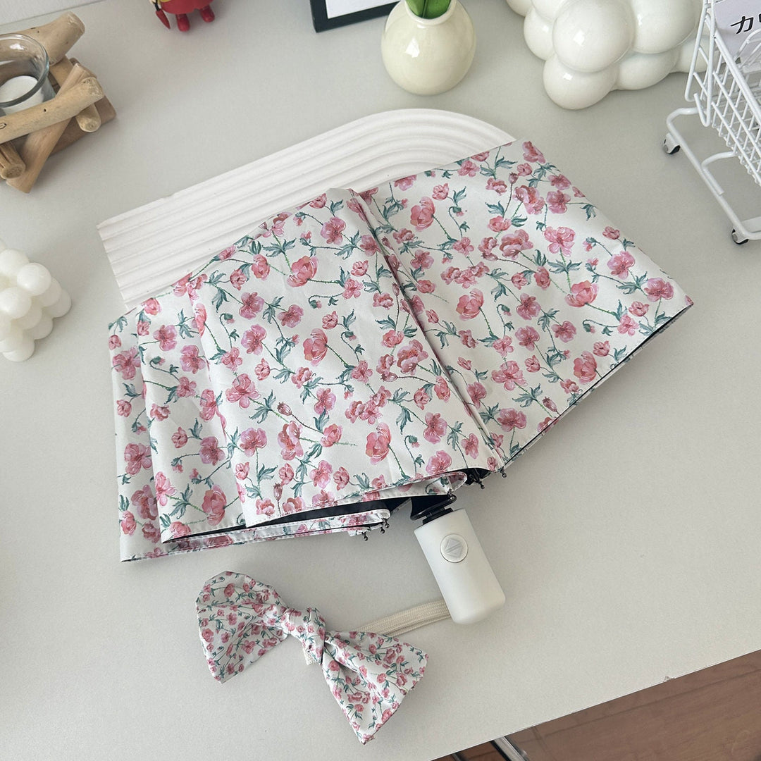 Women's folding umbrella with floral design and practical storage system Kalsten