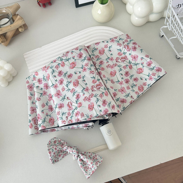 Women's folding umbrella with floral design and practical storage system Kalsten