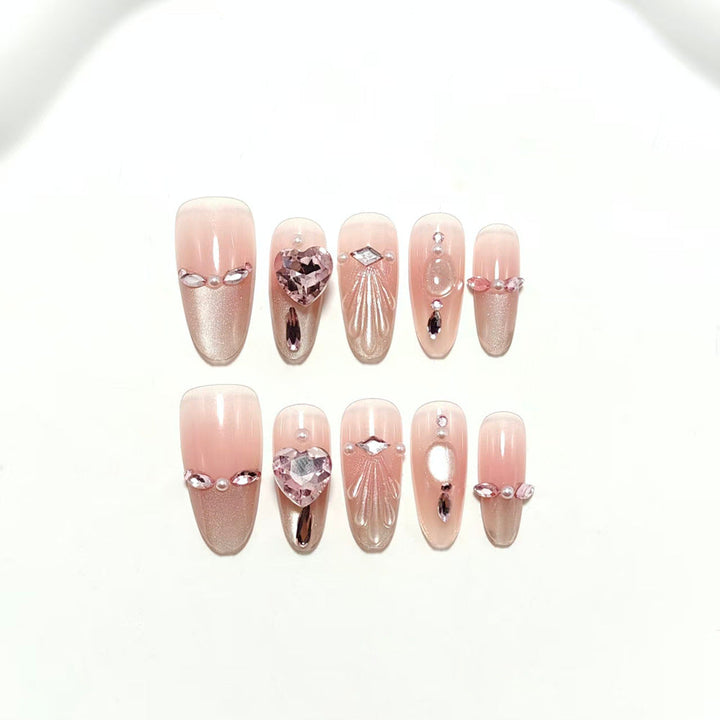Artificial nails with sparkling heart and rhinestone accents Kalsten