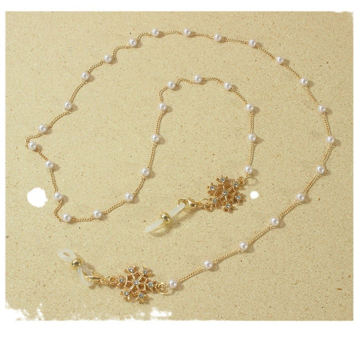 Elegant glasses holder chain with pearls and snowflake pendant Kalsten