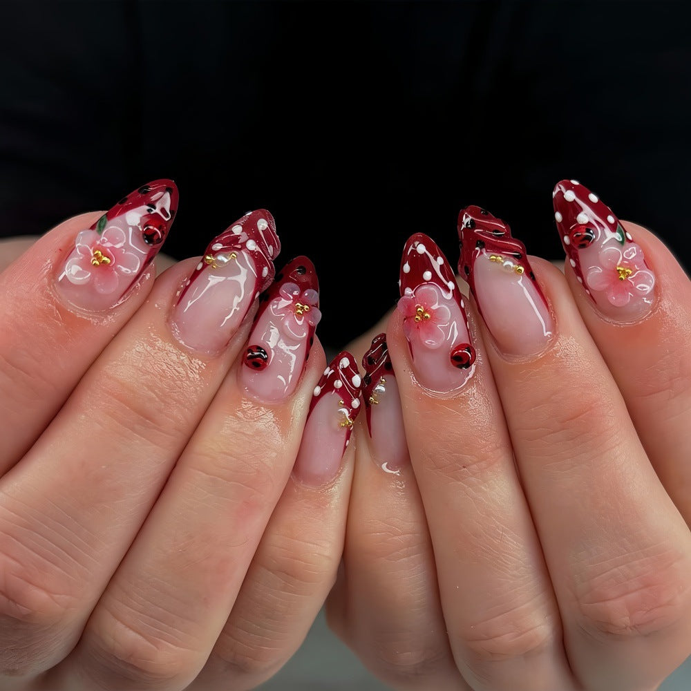 Artificial nails with floral design and 3D accents Kalsten