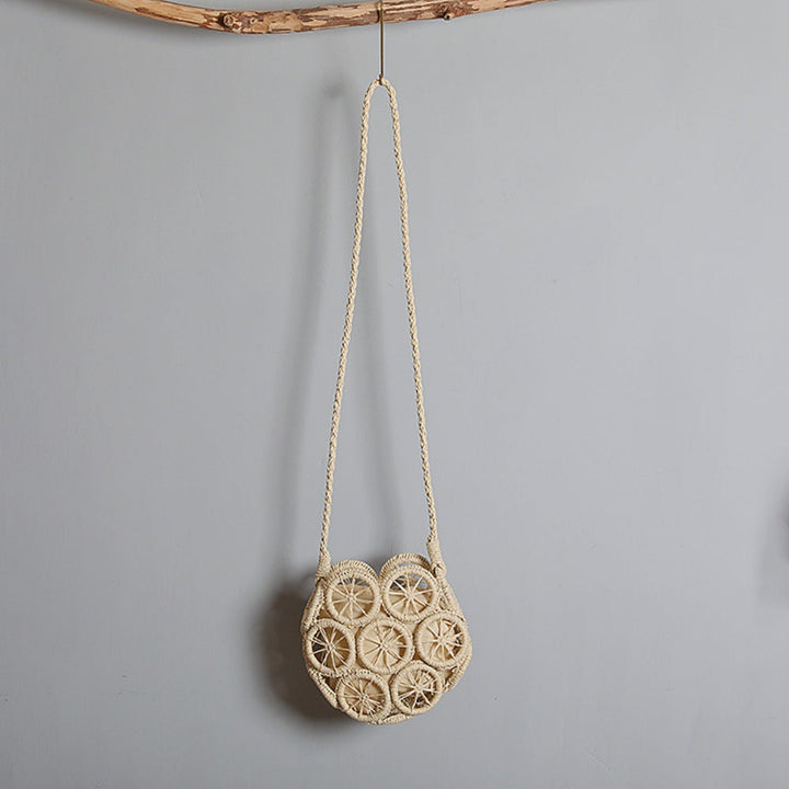 Shoulder bag made of handwoven raffia with intricate embellishments Kalsten