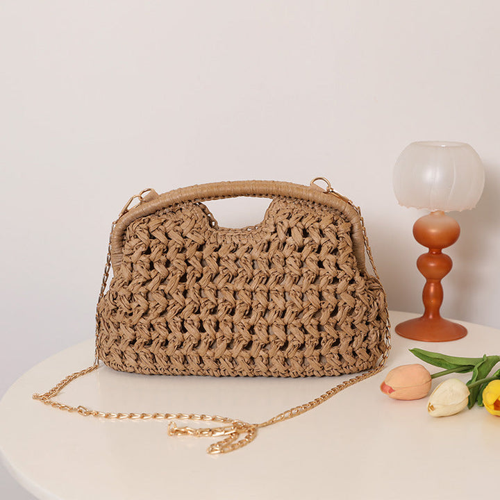 Handcrafted rattan bag with elegant handles and chain straps Kalsten