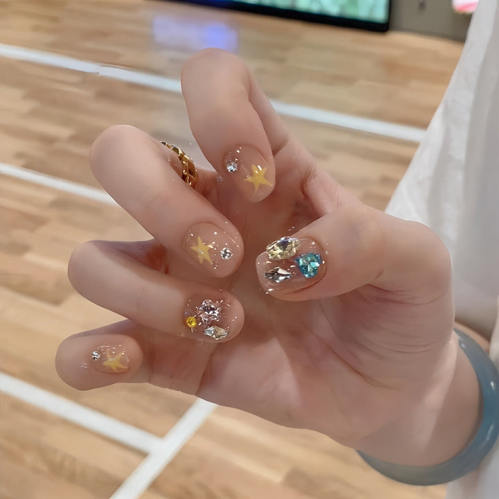 Glittering nail tips with elegant jewelry accents Kalsten