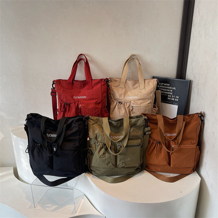 Tote bag with multifunctional outer pockets and adjustable shoulder strap Kalsten
