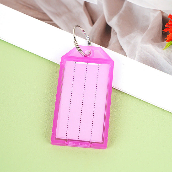 Unisex label tag with transparent sleeve and three writable fields Kalsten