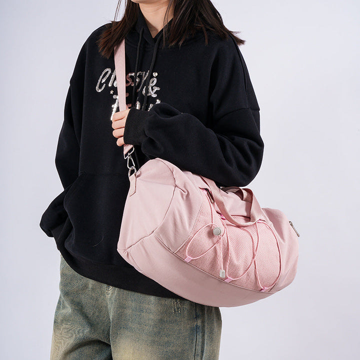 Sporty shoulder bag with adjustable carrying handles and breathable mesh material Kalsten