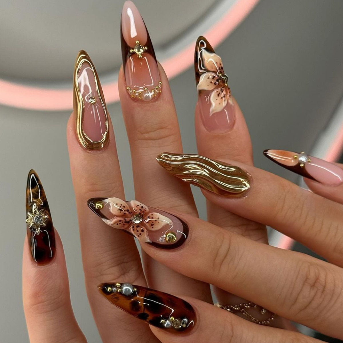 Artistic Stiletto Press-On Nail Art with Floral and Gemstone Accents Acalora