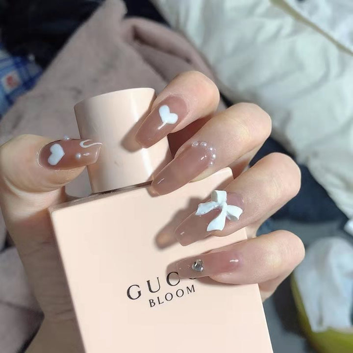 Artificial nails with heart design and glamorous accents Kalsten