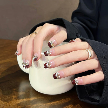 Acrylic nail set with elegant glitter and flower accents Acalora