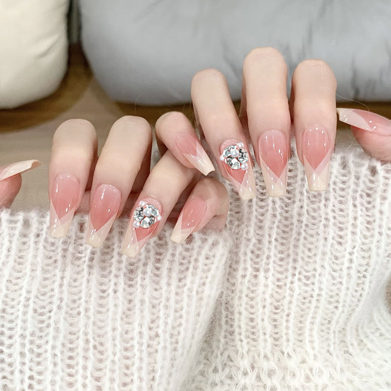 Artificial nail set with filigree tip designs and glamorous rhinestone accents Acalora
