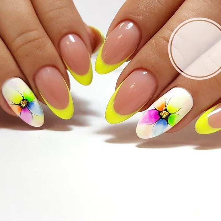 Stylish artificial nails with floral accents and colorful French tip design Kalsten