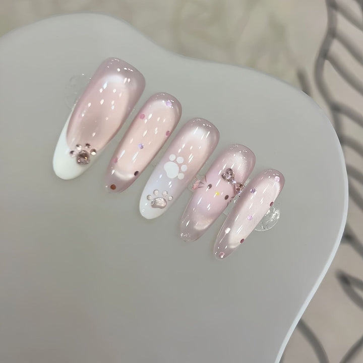 Artificial nail tips with playful penguin and paw print design Kalsten