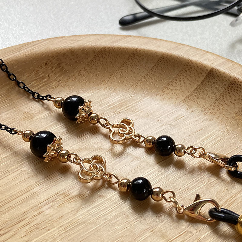 Filigree glasses chain holder with pearls and golden accents Kalsten