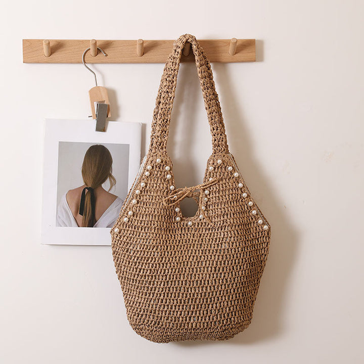 Handbag with pearl decor and innovative closure Kalsten