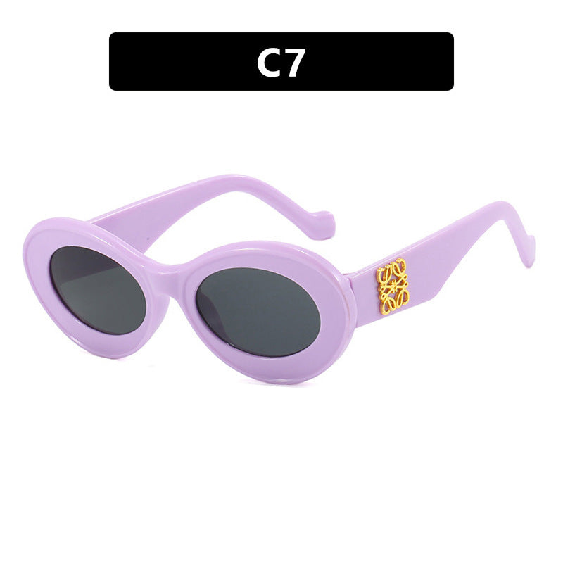 Women's fashionable sunglasses with oval frame and golden accents Kalsten