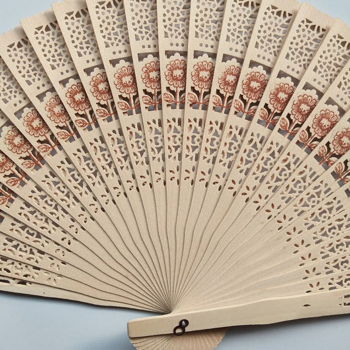 Ladies decorative hand fan made of high-quality wood with intricate cut-out work Kalsten