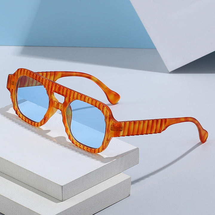 Ladies fashionable sunglasses in futuristic design with textured frame Kalsten