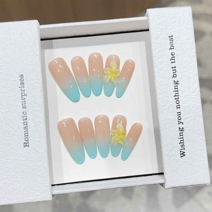 Artificial nails with enchanting ombre effect and floral accents Kalsten