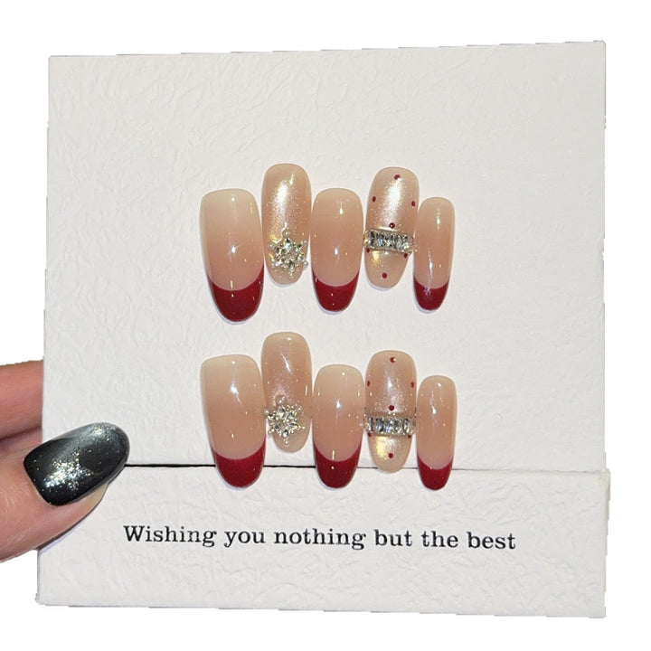 Artificial nails with festive design and rhinestone details Kalsten