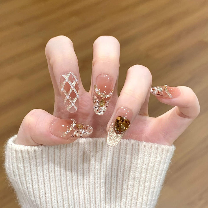 Glamorous artificial nails with glitter and heart design Kalsten