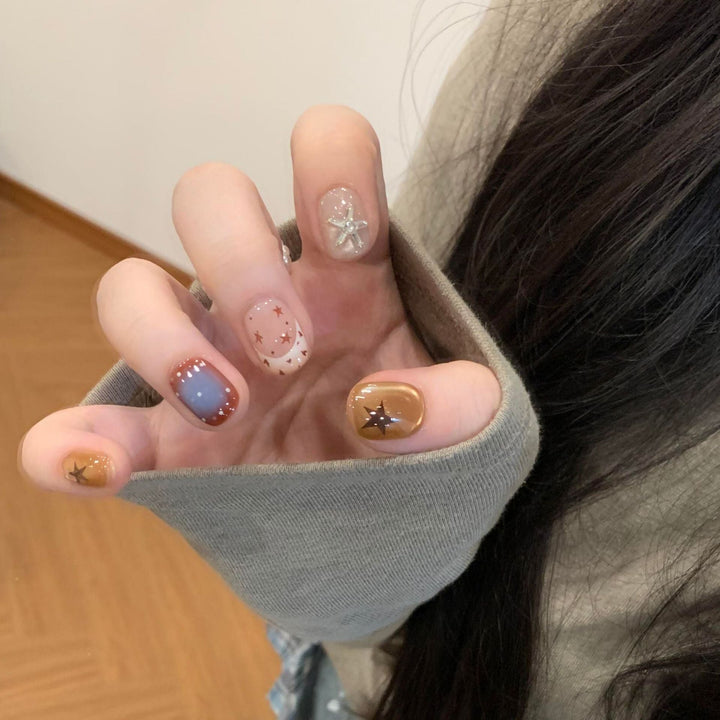 Artificial nails in modern design with star and gradient elements Kalsten