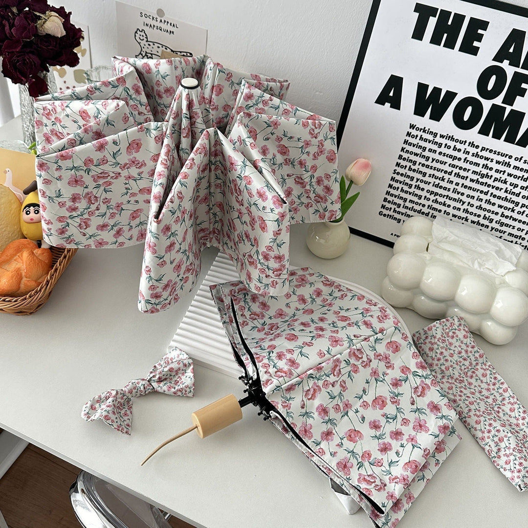 Women's folding umbrella with floral design and practical storage system Kalsten